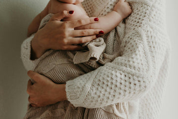 Mum holding her baby in Pyjamas